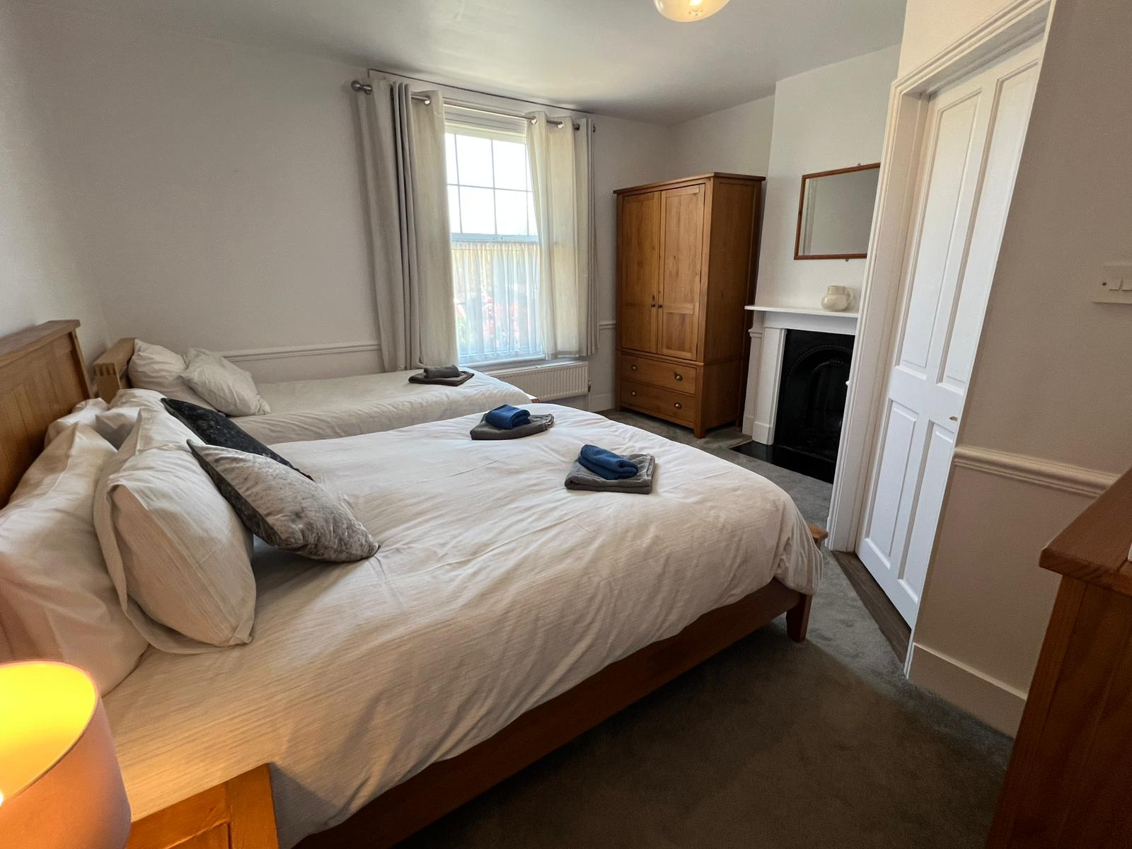 Family Room — double and single bed with fireplace